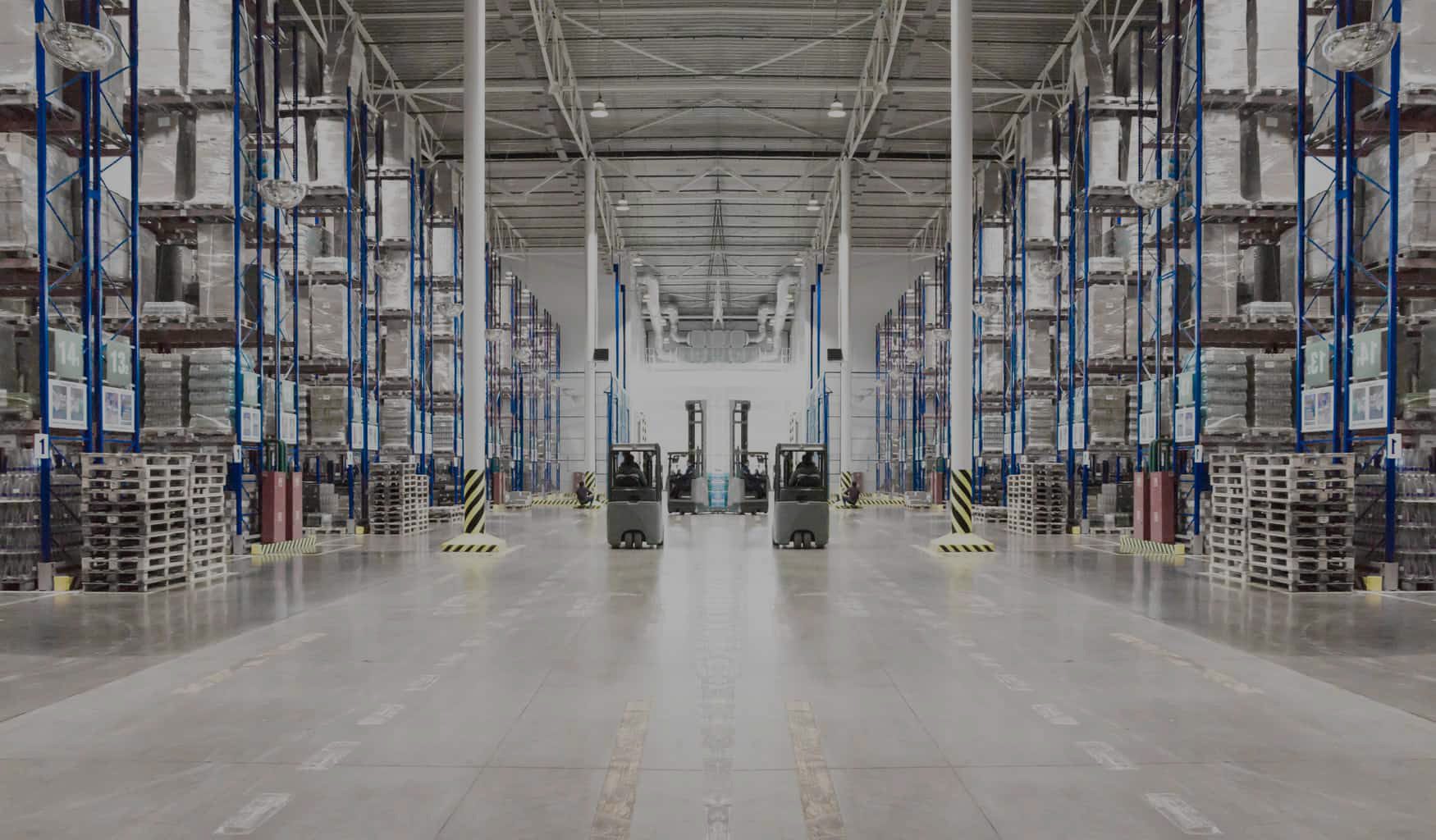 Heavy duty selective pallet rack aisle in a logistics warehouse
